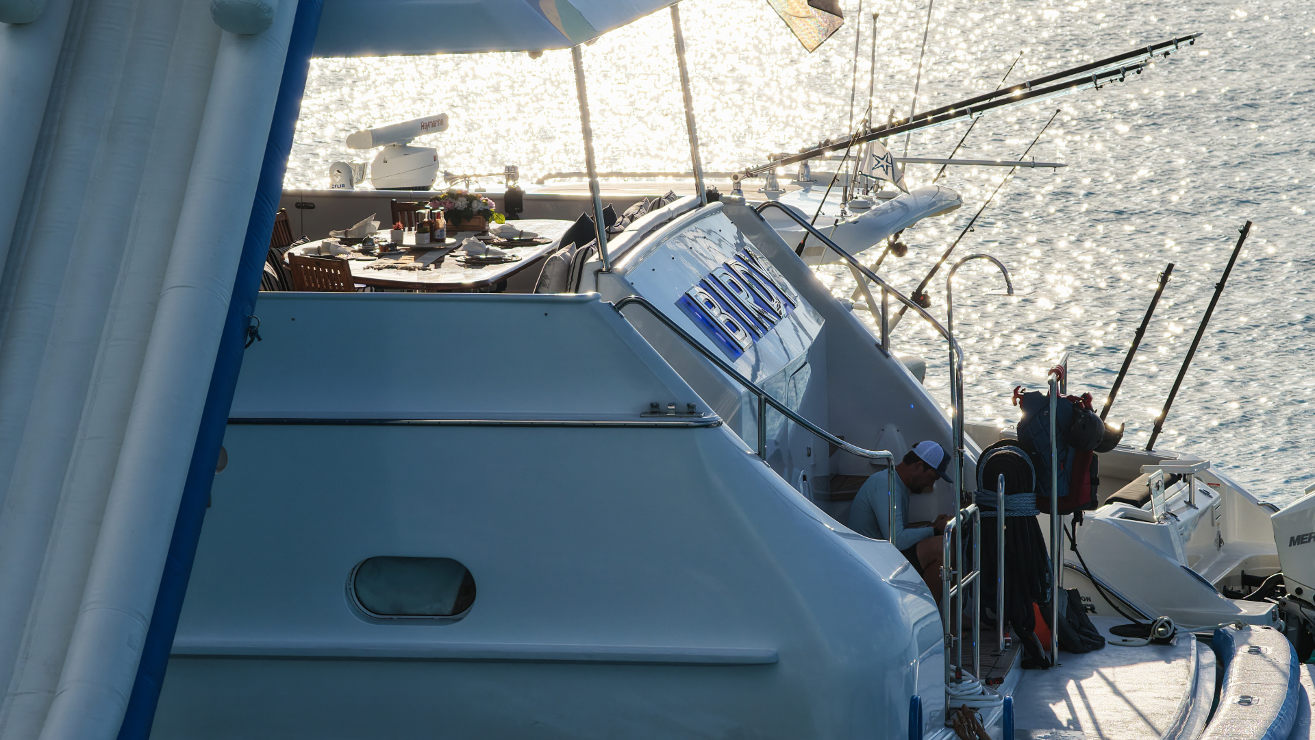 Aft deck dining setup sparkling in late afternoon light
