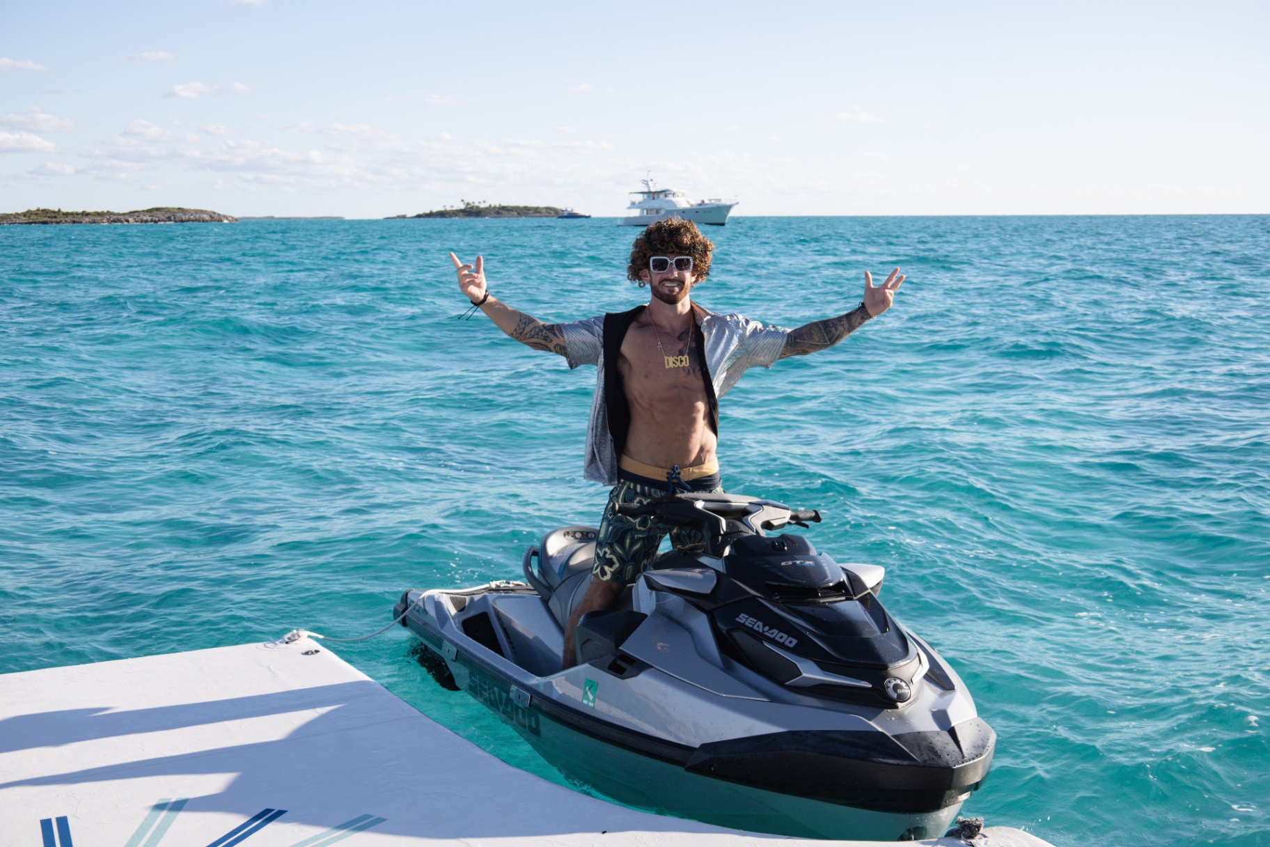 Guest celebrating on a Sea-Doo with Birdy in the distance