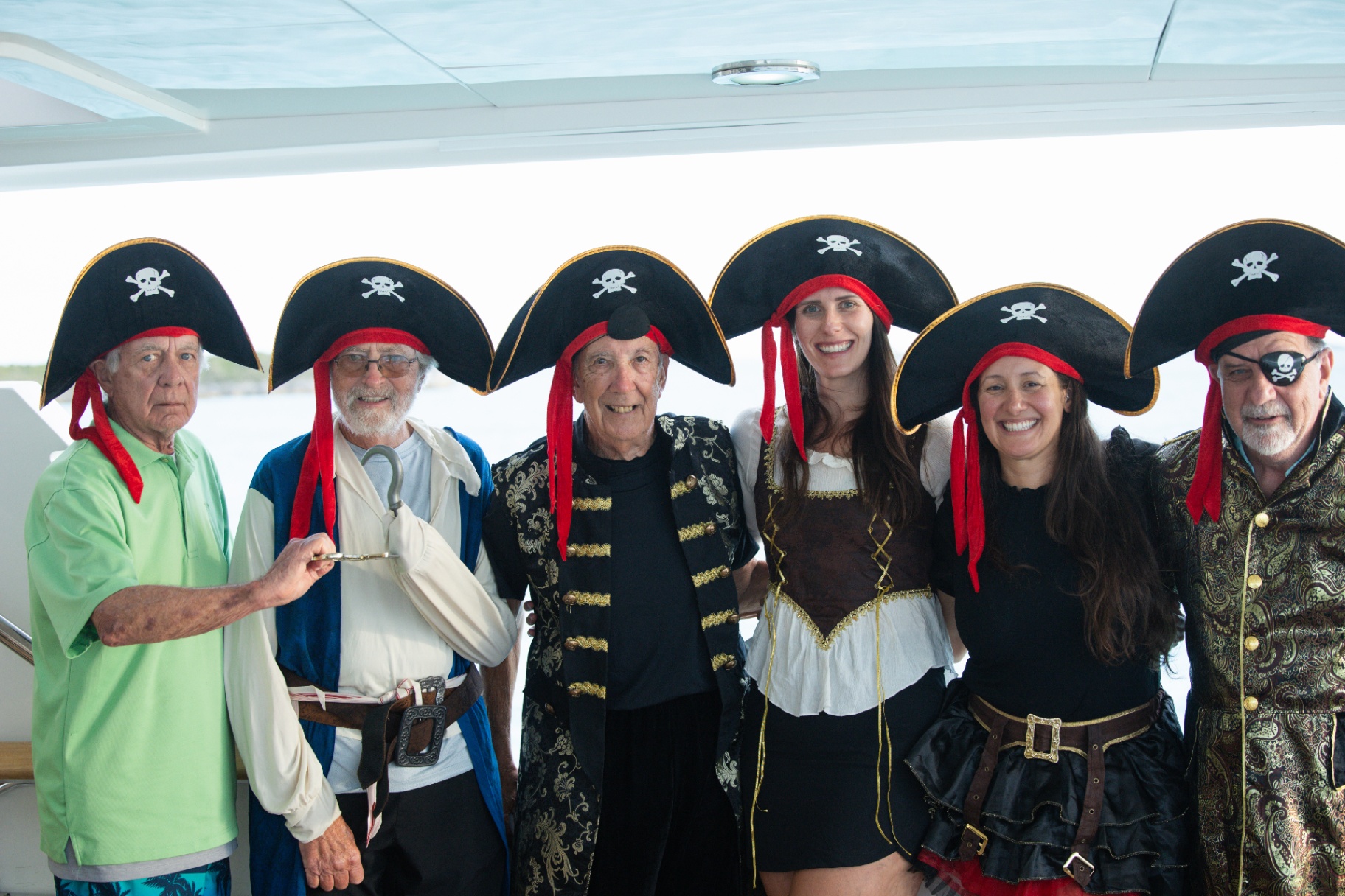 Guests in pirate costumes posing on the aft deck